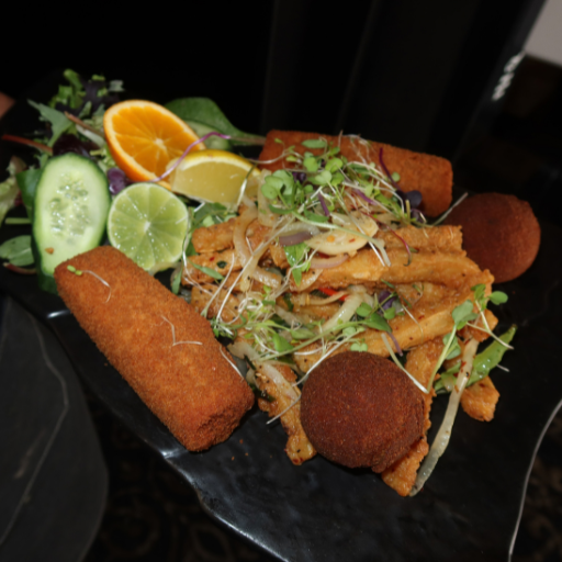 Sri Lankan entrées at Waadiya Royal Treat: pan roll, fish cutlet and hot butter calamari with salad