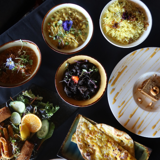 Bowls of curry, fresh salad and naan bread served as part of the Waadiya Royal Treat bottomless feast
